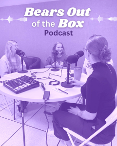 Picture of students speaking into mics while sitting around a table. Text reads, "Bears out of the box podcast."
