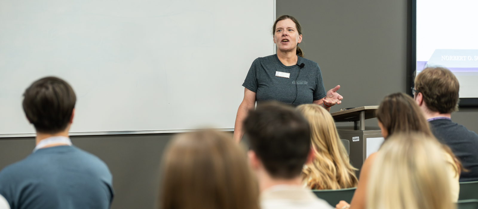Honors College faculty member lecturing in front of a group of students