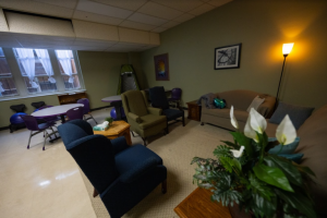 A dark room with comfortable furniture