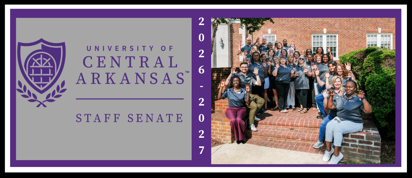 University of Central Arkansas Staff Senate banner featuring the university logo and name on a gray background, with “Staff Senate” beneath a horizontal line. The years “2026–2027” appear vertically between the logo and a group photograph of Staff Senate members posing on brick steps outside a campus building. The banner has a purple border and white outer margin.